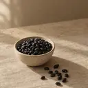 Black beans, photographed on stone.