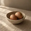 Eggs, photographed on stone.