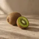 Kiwifruit, photographed on stone.