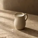 Milk, photographed on stone.