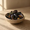 Mussels, photographed on stone.