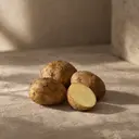 Potatoes, photographed on stone.