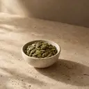 Pumpkin seeds, photographed on stone.