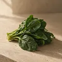 Spinach, photographed on stone.