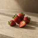 Strawberries, photographed on stone.