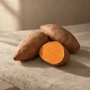 Sweet potato, photographed on stone.